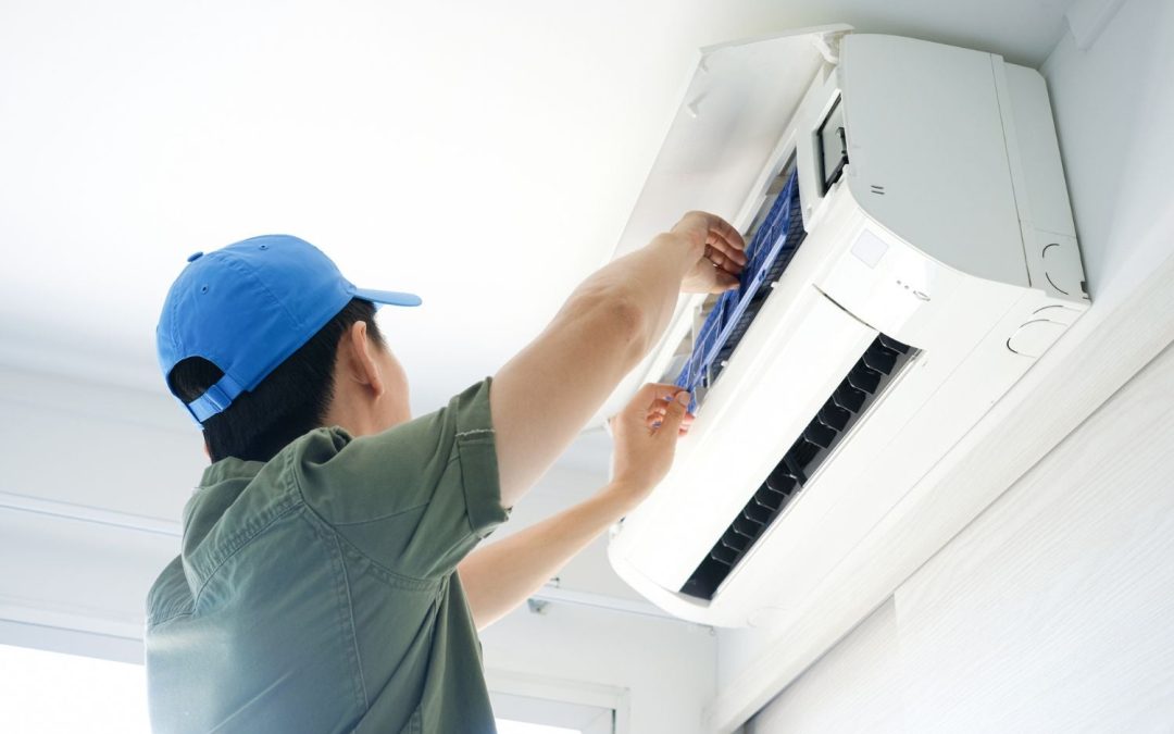 Air conditioning technician maintaining an indoor mini split system in Prescott, AZ